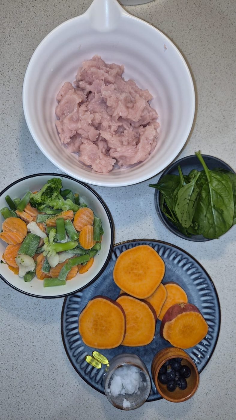 Fresh chicken mince, spinach, mixed vegetables, sweet potato and blueberries — the ingredients of the chicken loaf